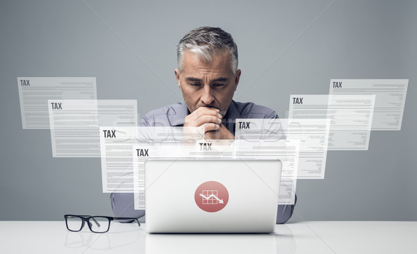 Adózás könyvelés töprengő üzletember adó online Stock fotó © stokkete