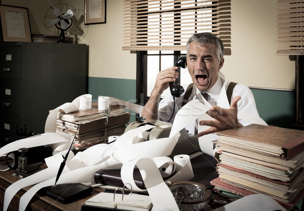 Angry vintage businessman shouting at phone Stock photo © stokkete