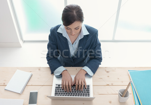 Office worker using a laptop Stock photo © stokkete