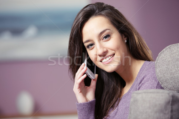 portrait of young smiling woman on phone Stock photo © stokkete