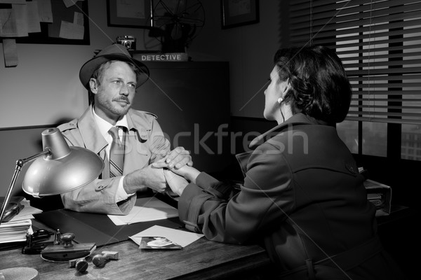 Handsome detective comforting a young scared woman Stock photo © stokkete
