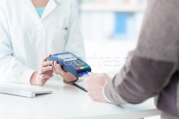Man purchasing products in the pharmacy Stock photo © stokkete