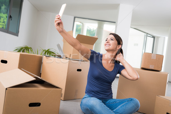 Woman taking a selfie in her new house Stock photo © stokkete