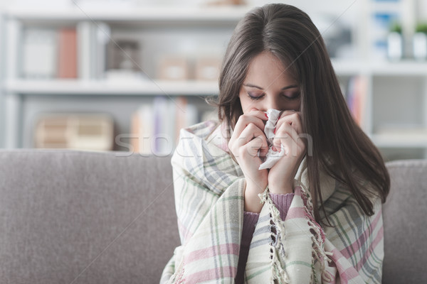Beteg nő influenza fiatal nő otthon kanapé Stock fotó © stokkete