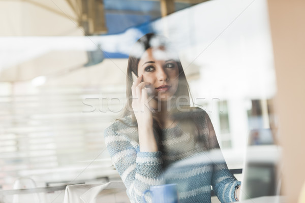 Young woman having a phone call Stock photo © stokkete
