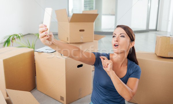 Woman taking a selfie in her new house Stock photo © stokkete