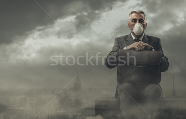 Businessman and polluted city Stock photo © stokkete