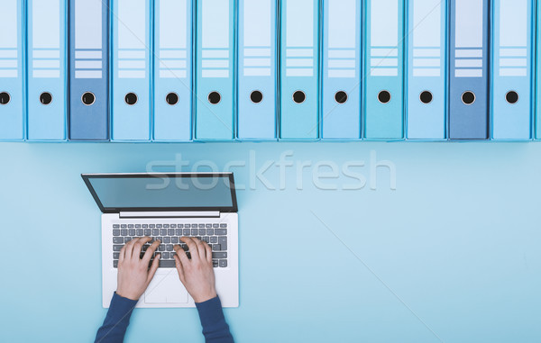 Stock photo: Searching files in the archive using a laptop