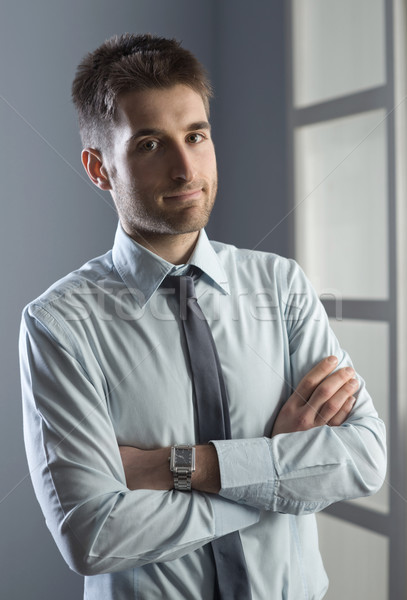 Attractive businessman posing Stock photo © stokkete