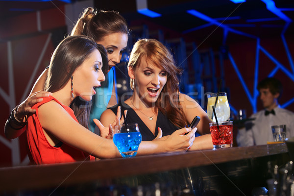 Enjoying with a smartphone Stock photo © stokkete