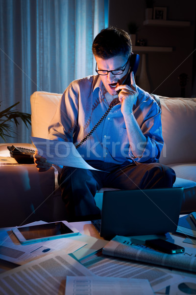 üzletember dolgozik túlóra otthon hangsúlyos késő Stock fotó © stokkete