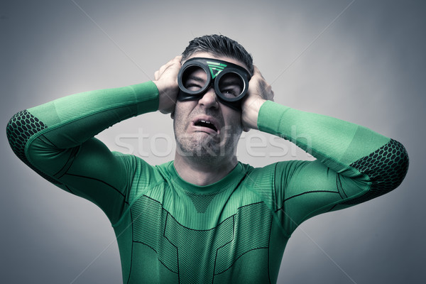 Superhero rău durere de cap trist puternic Imagine de stoc © stokkete