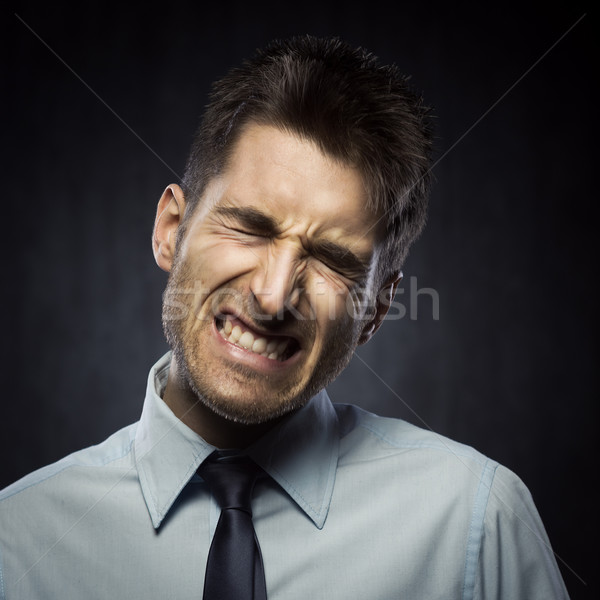 Angry young businessman Stock photo © stokkete