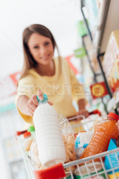 Woman shopping at the supermarket Stock photo © stokkete