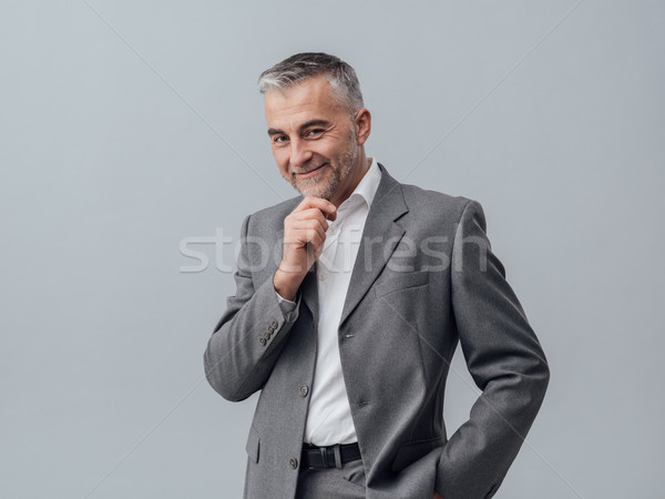 üzletember gondolkodik kéz áll okos jó Stock fotó © stokkete