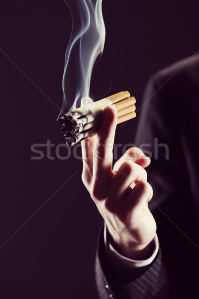 Fumée vue jeune homme fumer beaucoup cigarettes Photo stock © stokkete