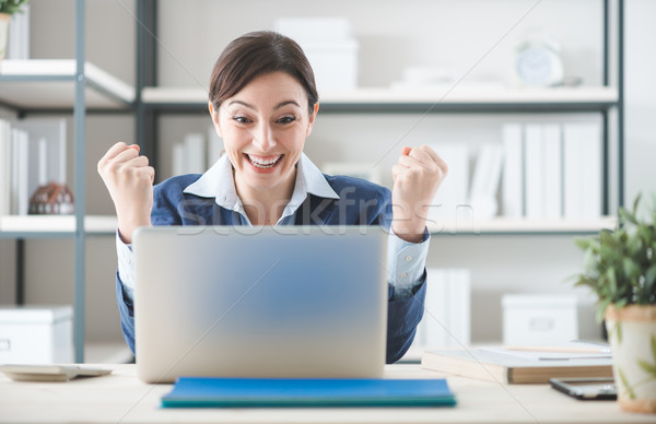 Cheerful businesswoman in her office Stock photo © stokkete