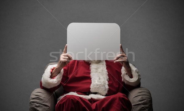 Santa Claus holding a sign Stock photo © stokkete