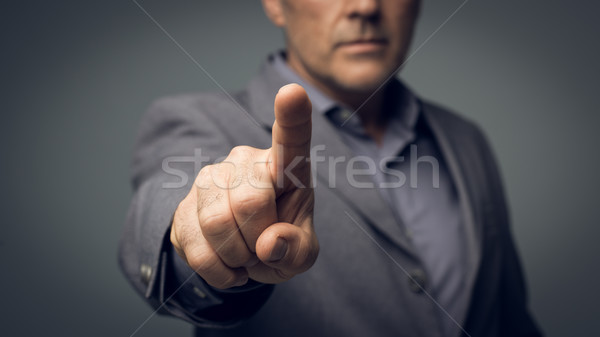бизнесмен виртуальный интерфейс указывая камеры указательный палец Сток-фото © stokkete