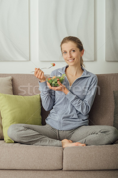 Young woman having lunch at home Stock photo © stokkete