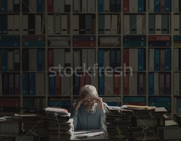 Overloaded senior office worker Stock photo © stokkete