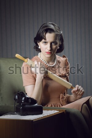Young woman examining make-up in mirror Stock photo © stokkete
