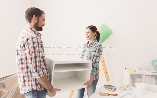 Couple déplacement mobilier jeunes heureux [[stock_photo]] © stokkete