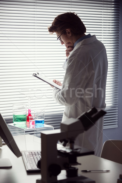 Researcher reading medical records Stock photo © stokkete