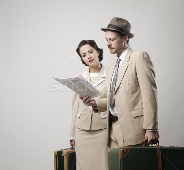Elegant couple leaving with luggage Stock photo © stokkete