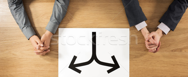 Elkülönítés üzletember üzletasszony ül asztal kezek Stock fotó © stokkete