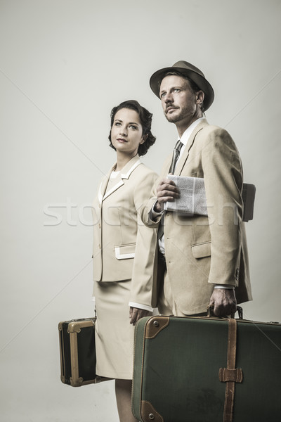 Stock photo: Elegant couple leaving with luggage