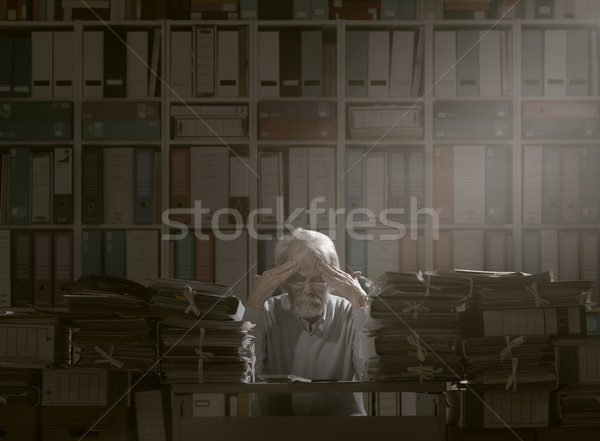 Overloaded senior office worker Stock photo © stokkete