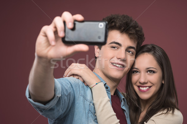 Young couple taking selfies Stock photo © stokkete