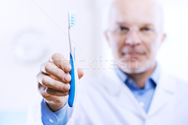 Fogápolás megelőzés fogorvos mutat férfi kórház Stock fotó © stokkete