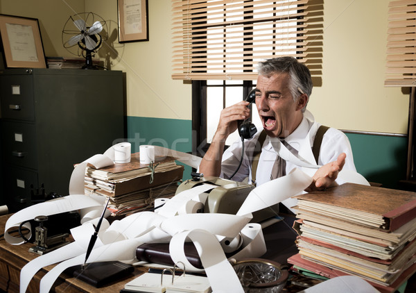 Angry vintage businessman shouting at phone Stock photo © stokkete