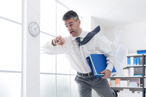 Businessman in a hurry checking time Stock photo © stokkete