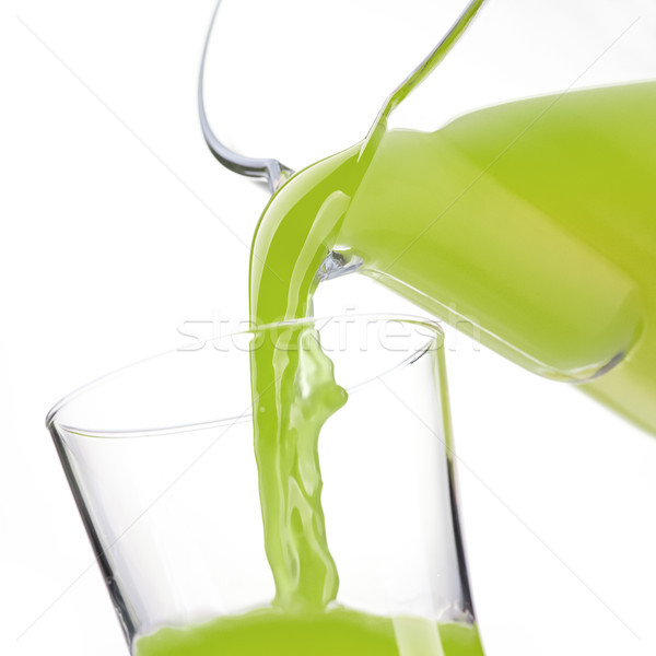 Pouring detox green juice in a glass Stock photo © stokkete