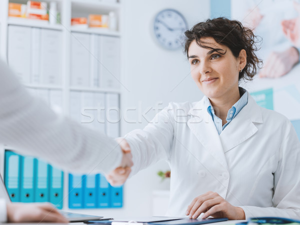 Doctor greeting a patient Stock photo © stokkete