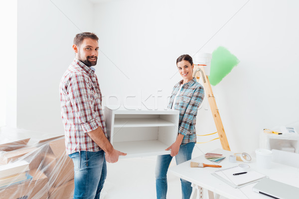 Couple moving furnishings in their new house Stock photo © stokkete