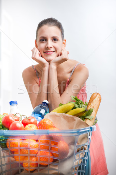 Woman shopping with hands on chin Stock photo © stokkete