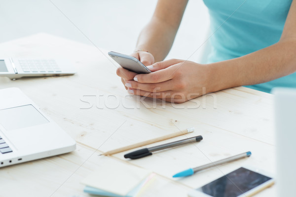 Teen girl texting with her mobile phone Stock photo © stokkete