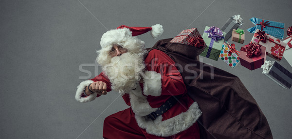 Kerstman lopen geschenken grappig christmas presenteert Stockfoto © stokkete