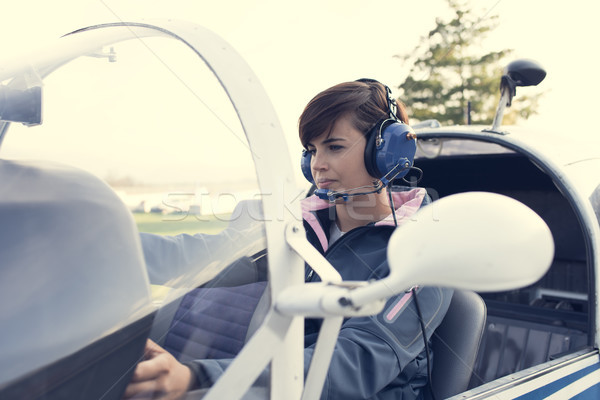 Pilot in the aircraft cockpit Stock photo © stokkete