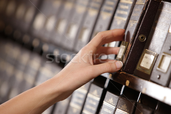 Searching in archives. Student hands searching from a filling ca Stock photo © stokkete