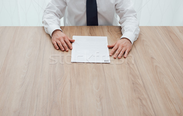 Businessman checking tax forms Stock photo © stokkete