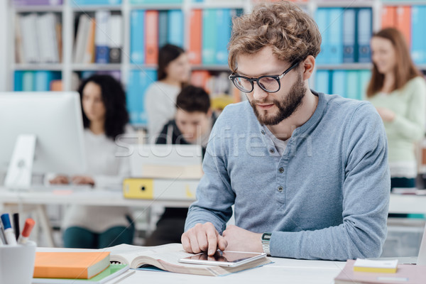 University students using a tablet Stock photo © stokkete