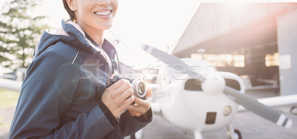 Smiling photographer at the airport Stock photo © stokkete