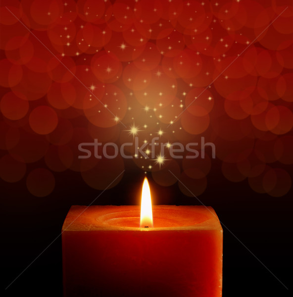 A single burning red candle  Stock photo © stokkete