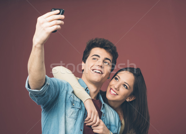 Young couple taking selfies Stock photo © stokkete