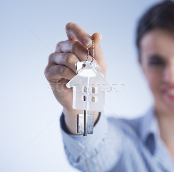 Holding out house keys Stock photo © stokkete